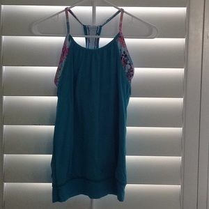 Tank with mesh overlay